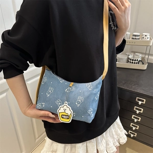 Blue denim crossbody bag with cute white bear prints and adjustable leather strap