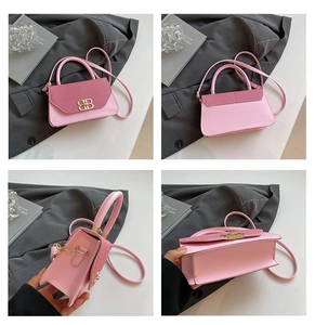 Detail shots of pink two-tone handbag with golden B-shaped buckle and crossbody strap