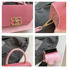 Detailed close-up of the golden BB metal buckle and pink woven texture on a handbag