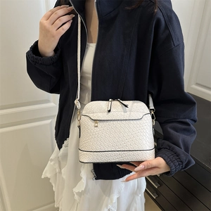 Chic white woven shell crossbody bag for women with elegant gold hardware detail