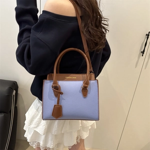 Blue and brown color-block handbag with lychee texture and adjustable shoulder strap
