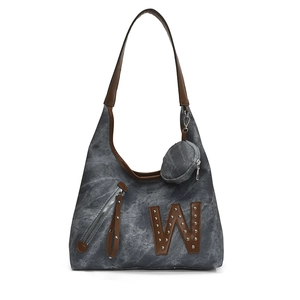 Large gray canvas tote bag with rivets and brown leather trim for casual use