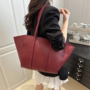 Chic burgundy faux leather tote bag with FASHION embossing for work and daily commute