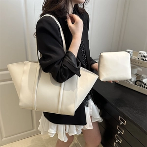 Minimalist beige tote bag set with matching zipper pouch and wide shoulder strap