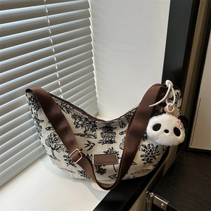 Retro canvas tote bag with landscape print and a cute panda plush charm accessory