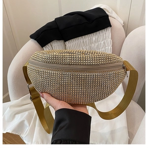 Detail of a sparkling gold rhinestone crossbody waist bag with adjustable strap