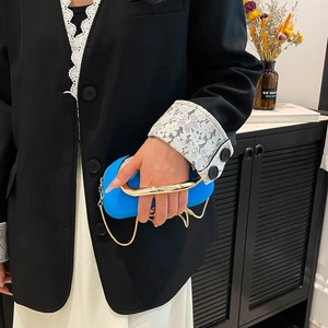Chic electric blue box clutch bag with gold U-shaped handle and chain strap for evening events