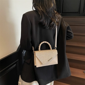 Elegant champagne sequin mini handbag with woven handle and beige crossbody strap for women