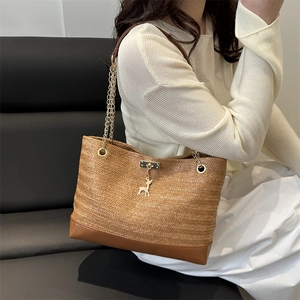 Vintage woven tote bag with brown leather base and gold chain shoulder straps for women