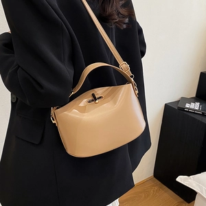 Elegant khaki faux leather handbag with metal lock and top handle for modern women