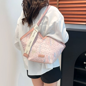 Pink quilted tote bag with colorful stripe embroidery and decorative wide logo strap