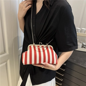 Striped crossbody shell bag with red and white patterns and golden chain strap for women