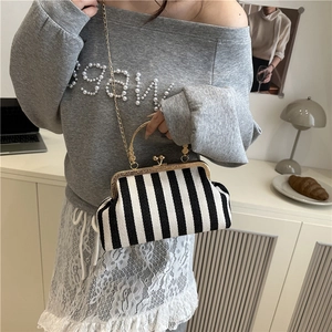 Retro black and white striped kiss-lock handbag with gold chain strap for women