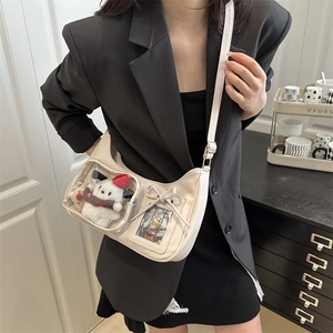 Fashionable cream white crossbody bag with clear display window and plush bear charm
