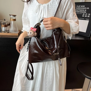 Women's large capacity brown patent leather tote bag with plush bear keychain charm