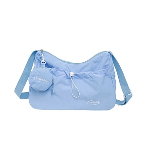 Light blue nylon tote bag with adjustable shoulder strap and small round coin purse