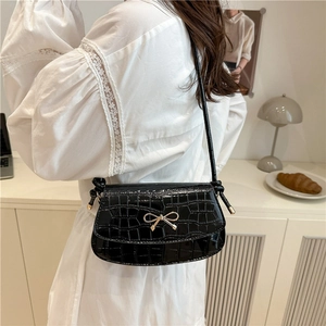 Elegant black crocodile pattern underarm bag with a golden metal bow for women