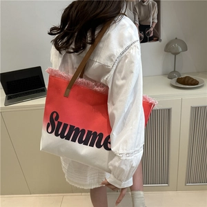 Chic red gradient canvas tote bag with fringe edge and leather handles for summer