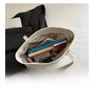 Inside view of strawberry tote bag showing large capacity and checkered lining