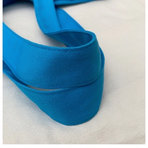 Close-up of vibrant blue woven canvas strap with durable high-density stitching details