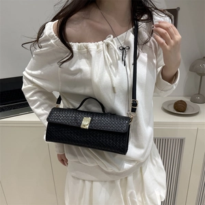 Elegant black woven leather shoulder bag with gold metal buckle and top handle