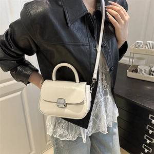 Chic cream white glossy crossbody handbag with silver clasp and top handle for women
