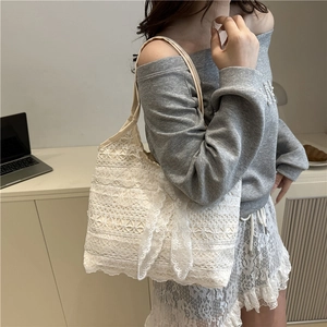Elegant white lace tote bag for women featuring a delicate bow and layered floral patterns