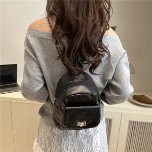 Chic black quilted mini backpack with chain straps and silver twist lock for women
