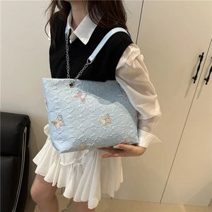 Light blue butterfly tote bag with sequin embroidery and silver chain strap