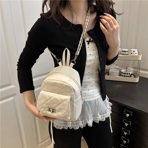 Elegant cream quilted backpack with diamond pattern and leather chain straps
