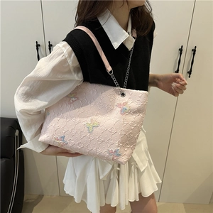 Pink quilted shoulder bag for women with colorful butterfly details and chain strap