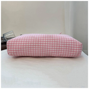 Close-up of pink and white checkered fabric tote bag bottom with clean cotton texture