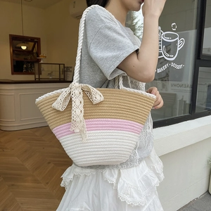 Three-color striped woven beach tote bag with cotton rope handles and lace bow charm