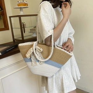 Three-color striped woven beach tote bag with cotton rope handles and beige lace bow