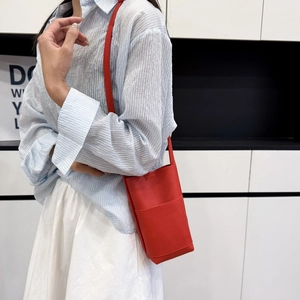 Vertical red litchi grain leather crossbody phone bag with front pocket for women