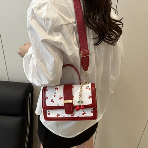 Elegant white crossbody bag with red cherry print and leather strap for women