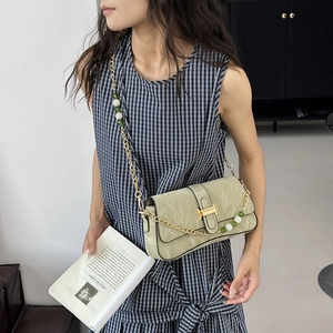 Chic sage green pleated faux leather shoulder bag with golden chain and pearl strap detail