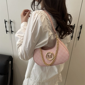 Pink crescent underarm bag with matte finish and gold M buckle for fashion look