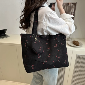 Large black corduroy tote bag with cherry print and matching small round purse
