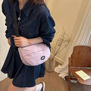 Minimalist lavender half-moon crossbody bag with adjustable wide shoulder strap