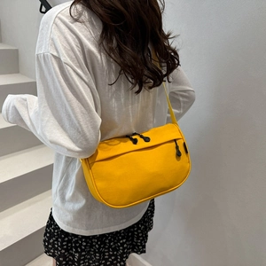Waterproof yellow crossbody bag for men and women with wide strap and half-moon shape