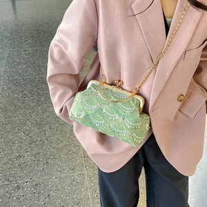 Light green lace evening clutch with silver sequins and golden metal chain strap
