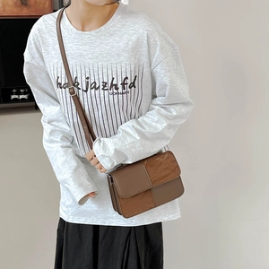 Brown patchwork crossbody bag for women with pleated texture and adjustable shoulder strap
