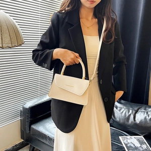 Modern two-tone woven leather handbag for women featuring a minimalist fashion design