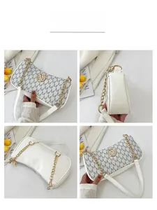 Detailed views of white crescent shoulder bag with grey M-letter monogram and gold chain