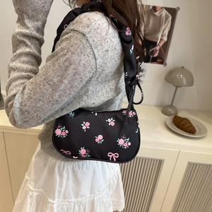 Floral hobo shoulder bag with pink patterns on black nylon for a sweet aesthetic style