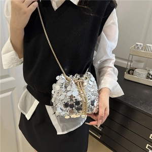 Sparkly silver sequin bucket bag with gold chain strap and pearl drawstring detail