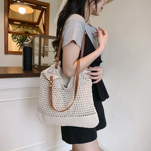 Chic hollow-out crochet tote bag with large capacity and brown leather straps