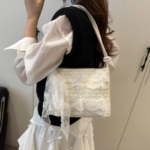 Elegant white lace shoulder bag with floral embroidery and bow detail for summer