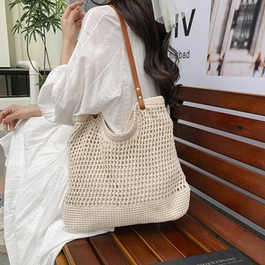 Chic hollow mesh woven tote bag with brown leather strap for summer casual style